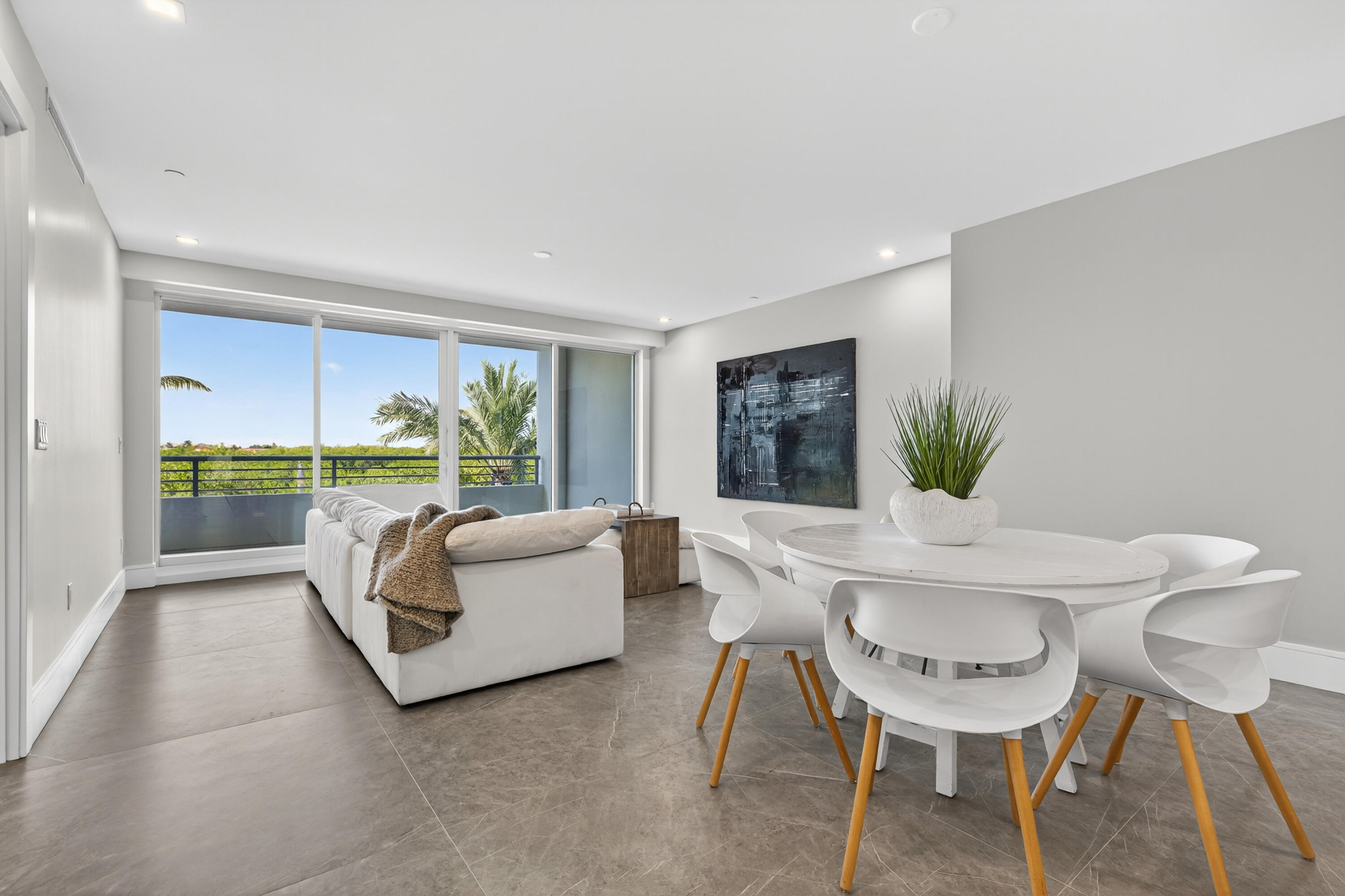 1 South Coastal Way, Unit 205 Jupiter, FL 33477 - Photo 14 of 67 a living room with furniture and a large window