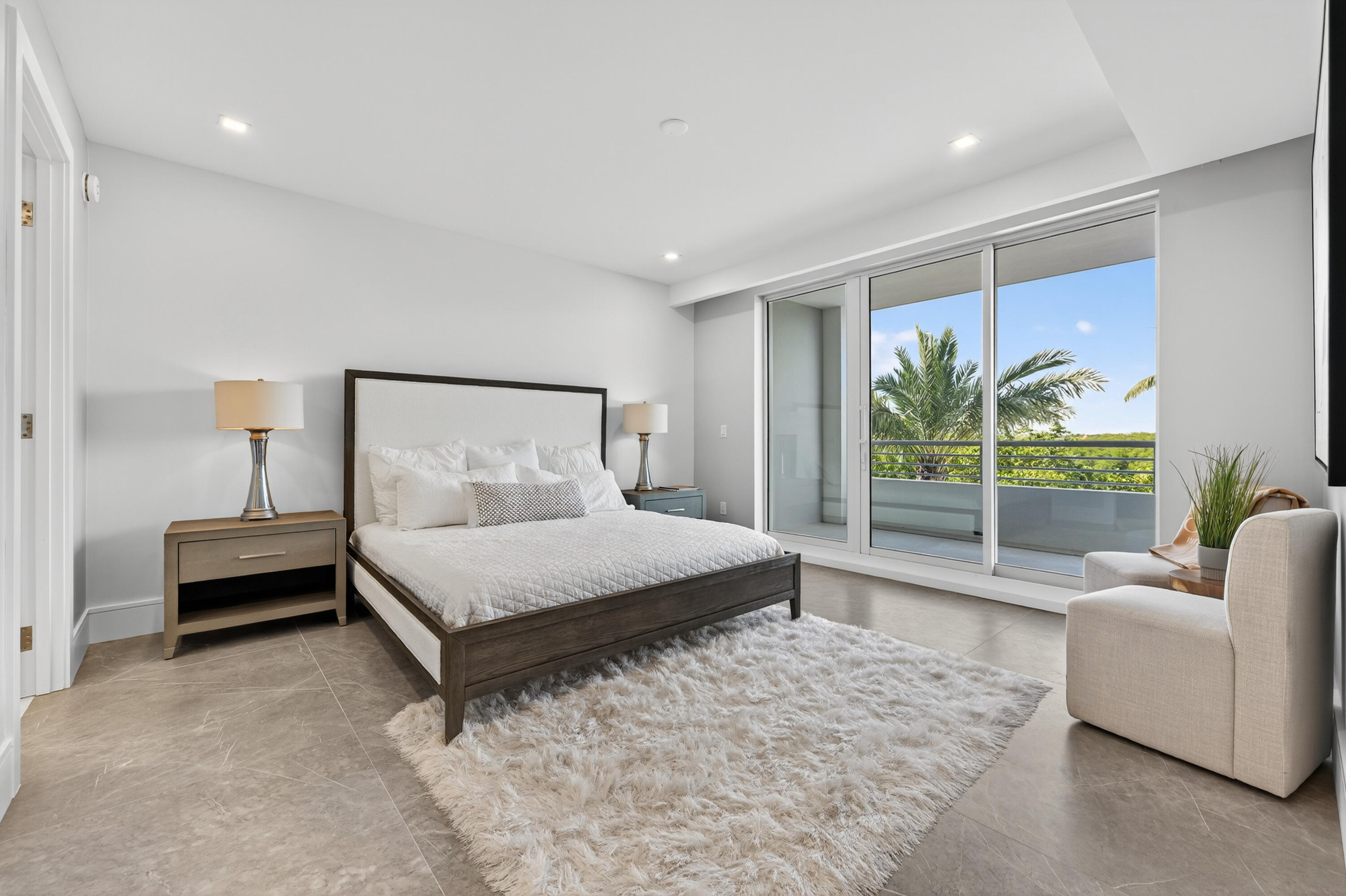 1 South Coastal Way, Unit 205 Jupiter, FL 33477 - Photo 16 of 67 a bedroom with a bed and glass walk in closet