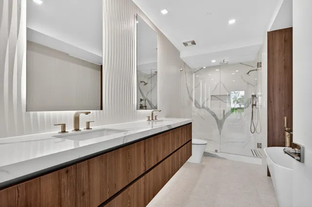 a view of a floor to ceiling window and tree in front of it