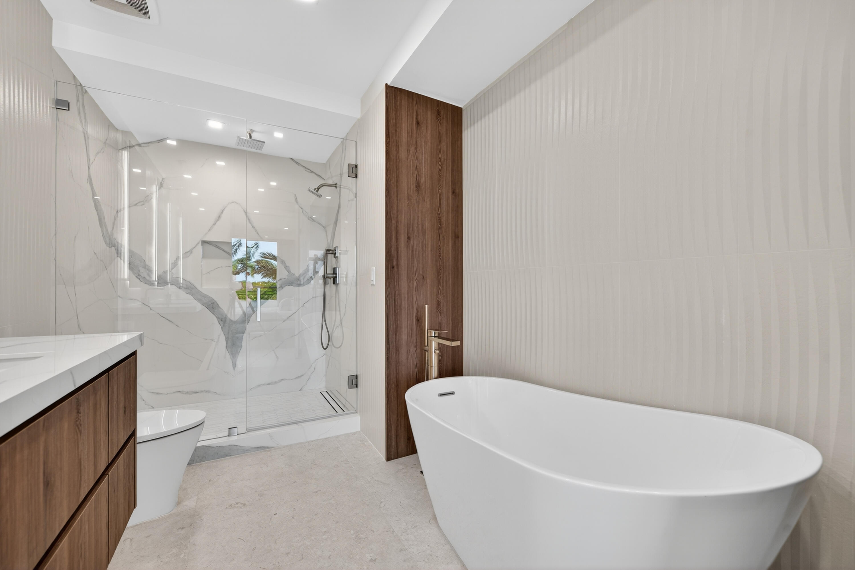 1 South Coastal Way, Unit 205 Jupiter, FL 33477 - Photo 18 of 67 a white bath tub sitting next to a white toilet