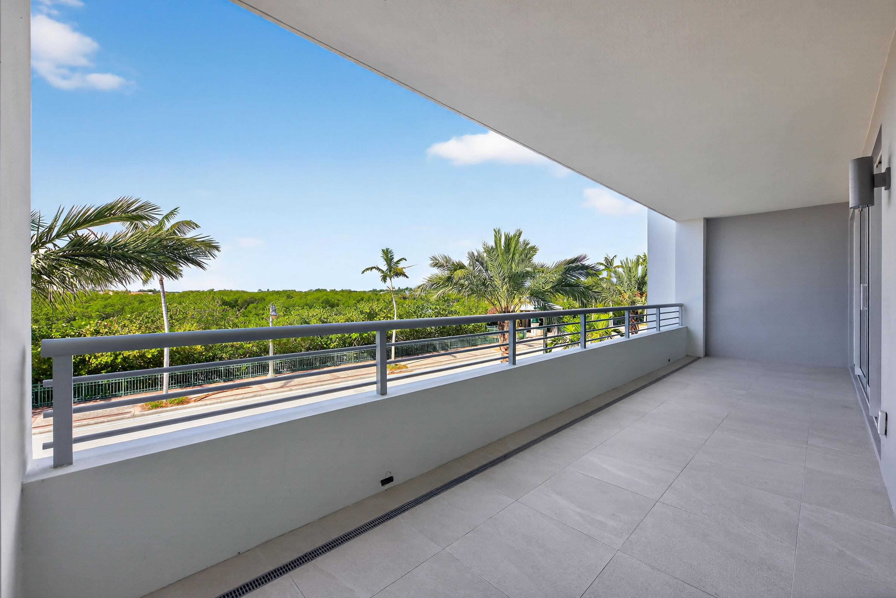 1 South Coastal Way, Unit 205 Jupiter, FL 33477 - Photo 23 of 67 a view of a floor to ceiling window and tree in front of it