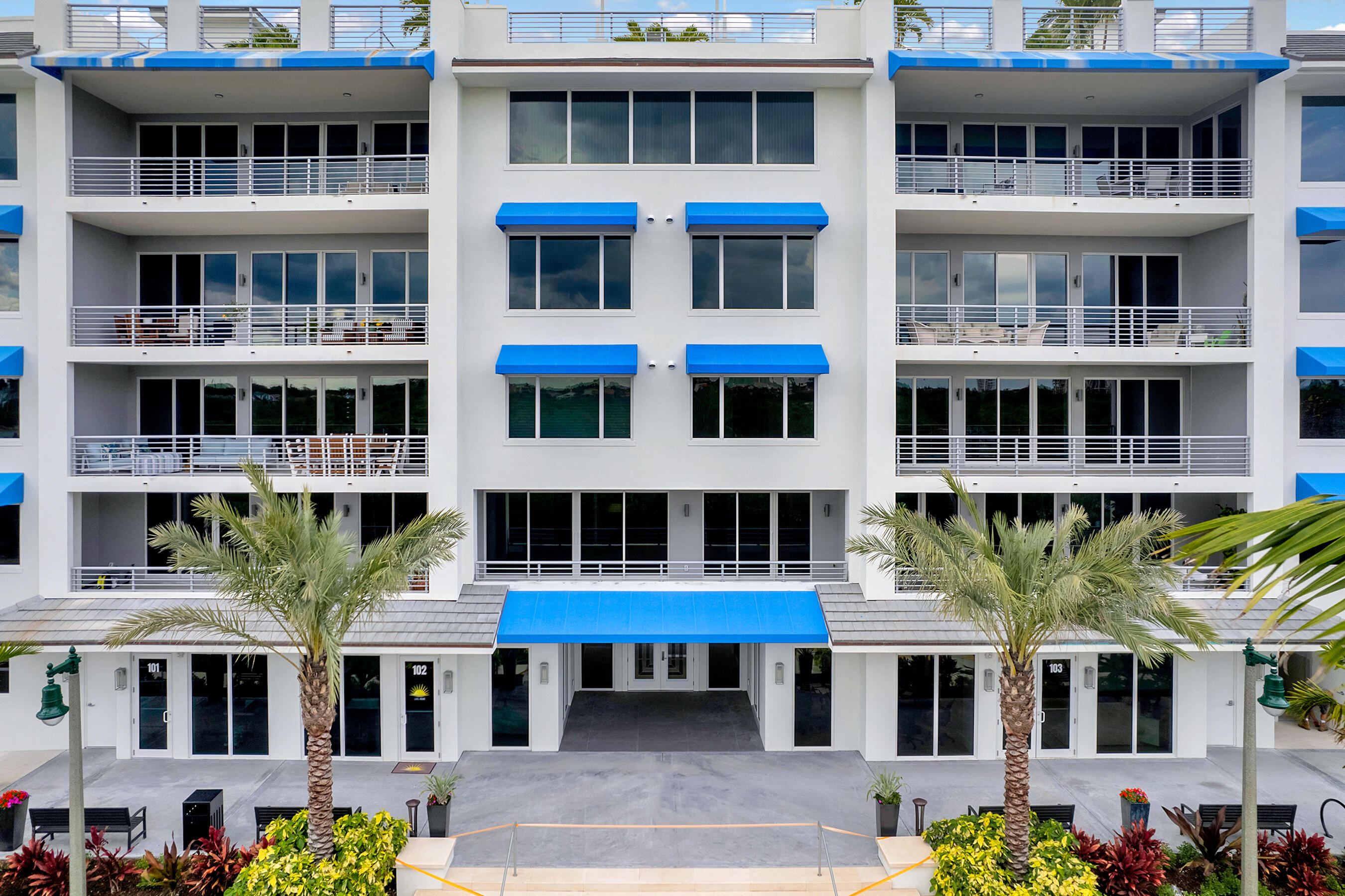 1 South Coastal Way, Unit 205 Jupiter, FL 33477 - Photo 27 of 67 a front view of a building with a lot of windows