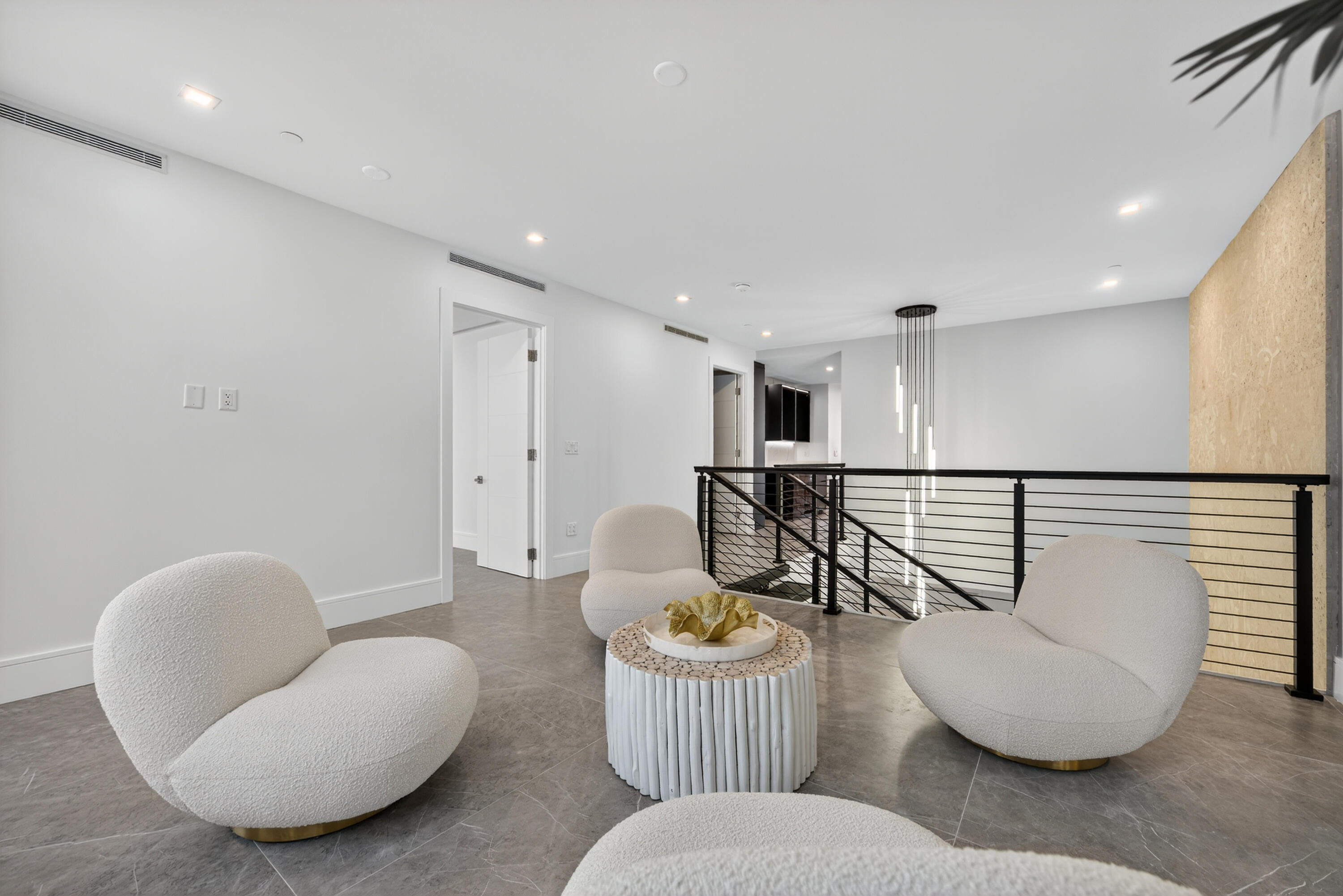1 South Coastal Way, Unit 205 Jupiter, FL 33477 - Photo 9 of 67 a living room with furniture and a wooden floor