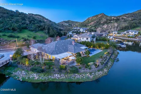 an aerial view of lake and residential houses