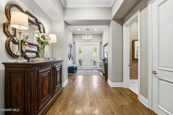 a view of a hallway view with wooden floor and staircase