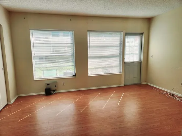 a view of an empty room with a window