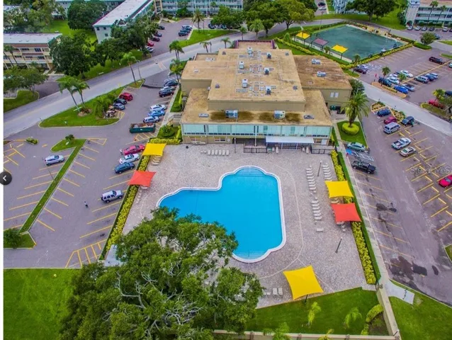 an aerial view of residential houses with swimming pool