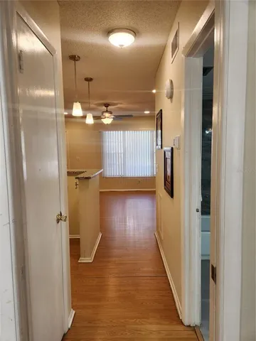 a view of gallery with wooden floor