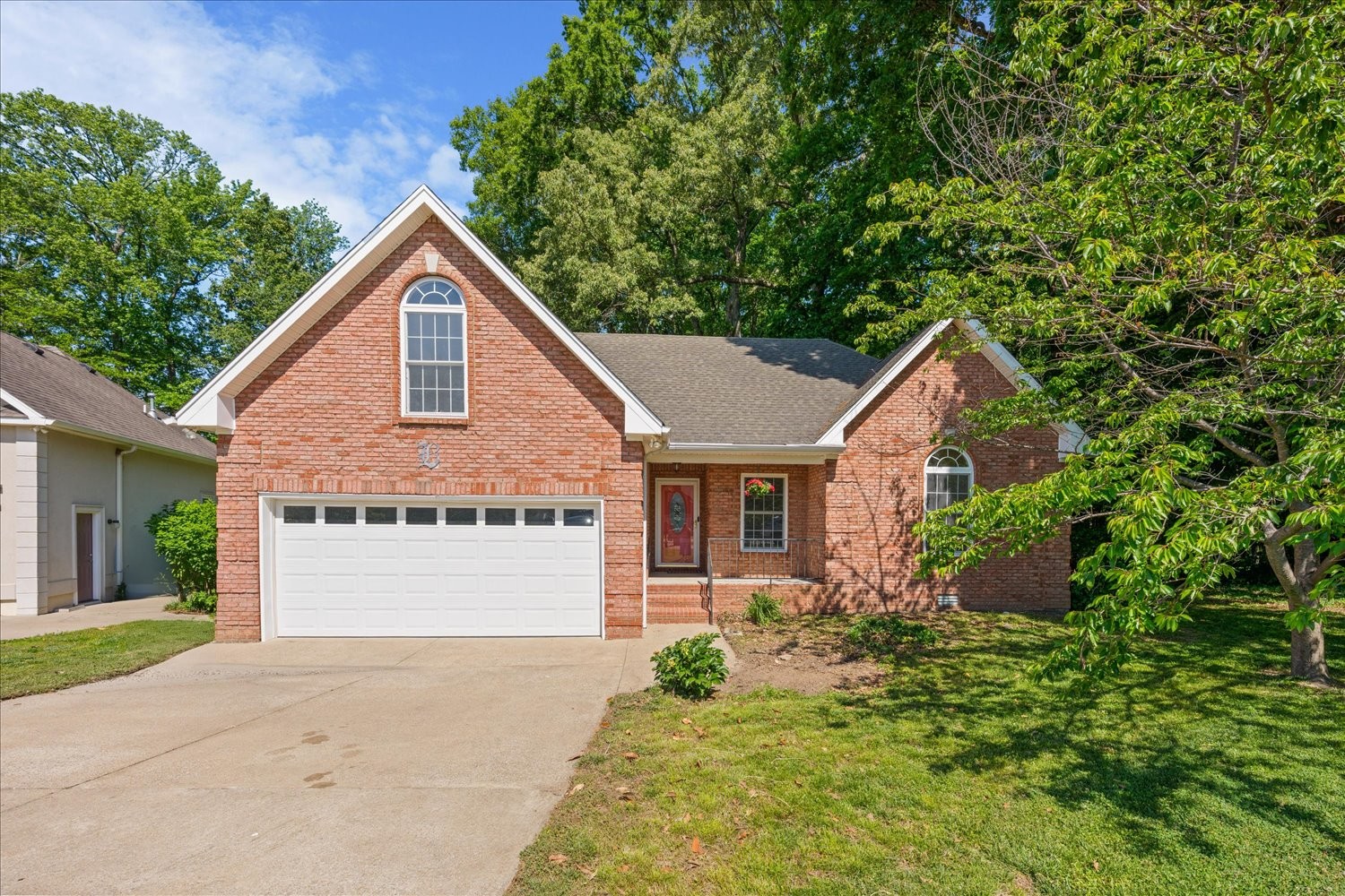 113 Brookview Court Springfield, TN 37172 - Photo 1 of 46 a front view of a house with a garden