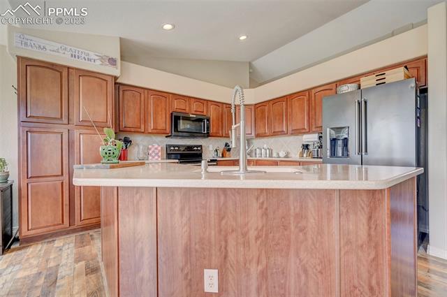 9470 Rockingham Drive Peyton, CO 80831 - Photo 8 of 39 kitchen has tons of counter space and storage