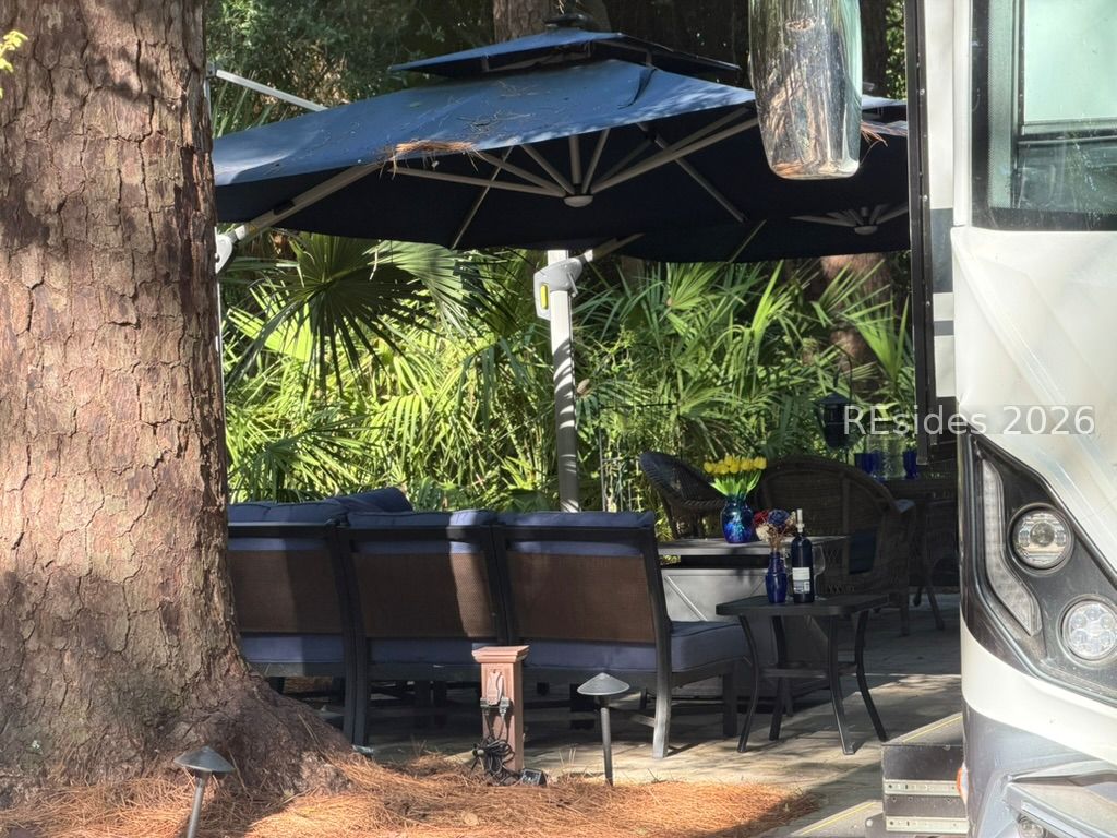 133 Arrow Road, Unit 23 Hilton Head Island, SC 29928 - Photo 2 of 22 Multiple sitting areas hidden behind trees-Loop 1