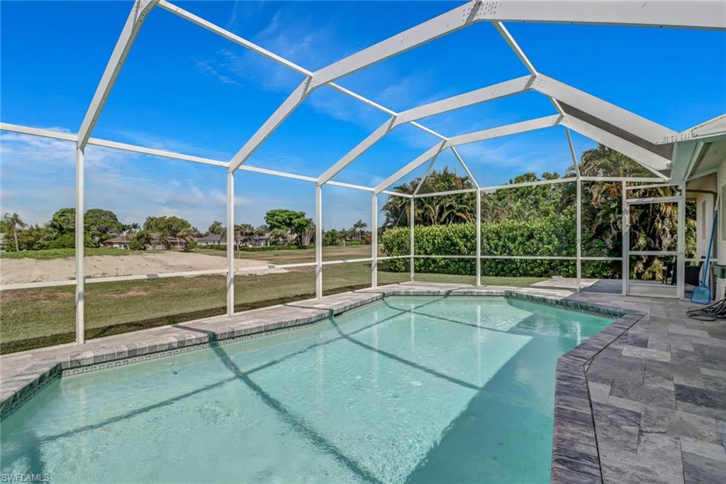 148 Pebble Beach Boulevard Naples, FL 34113 - Photo 20 of 24 a view of a backyard