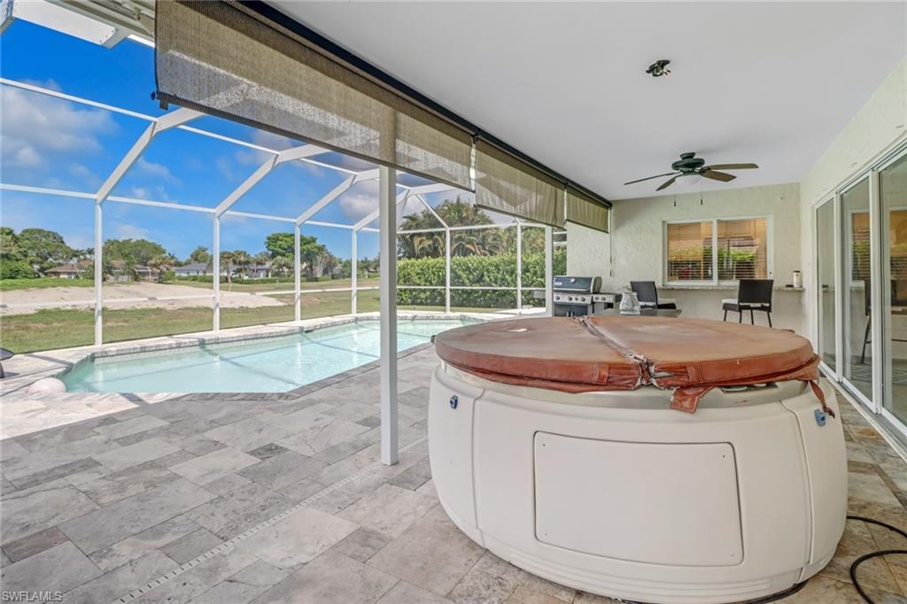 148 Pebble Beach Boulevard Naples, FL 34113 - Photo 22 of 24 a view of a livingroom with furniture and staircase