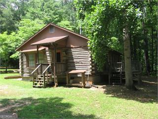 a view of a house with backyard and a slide