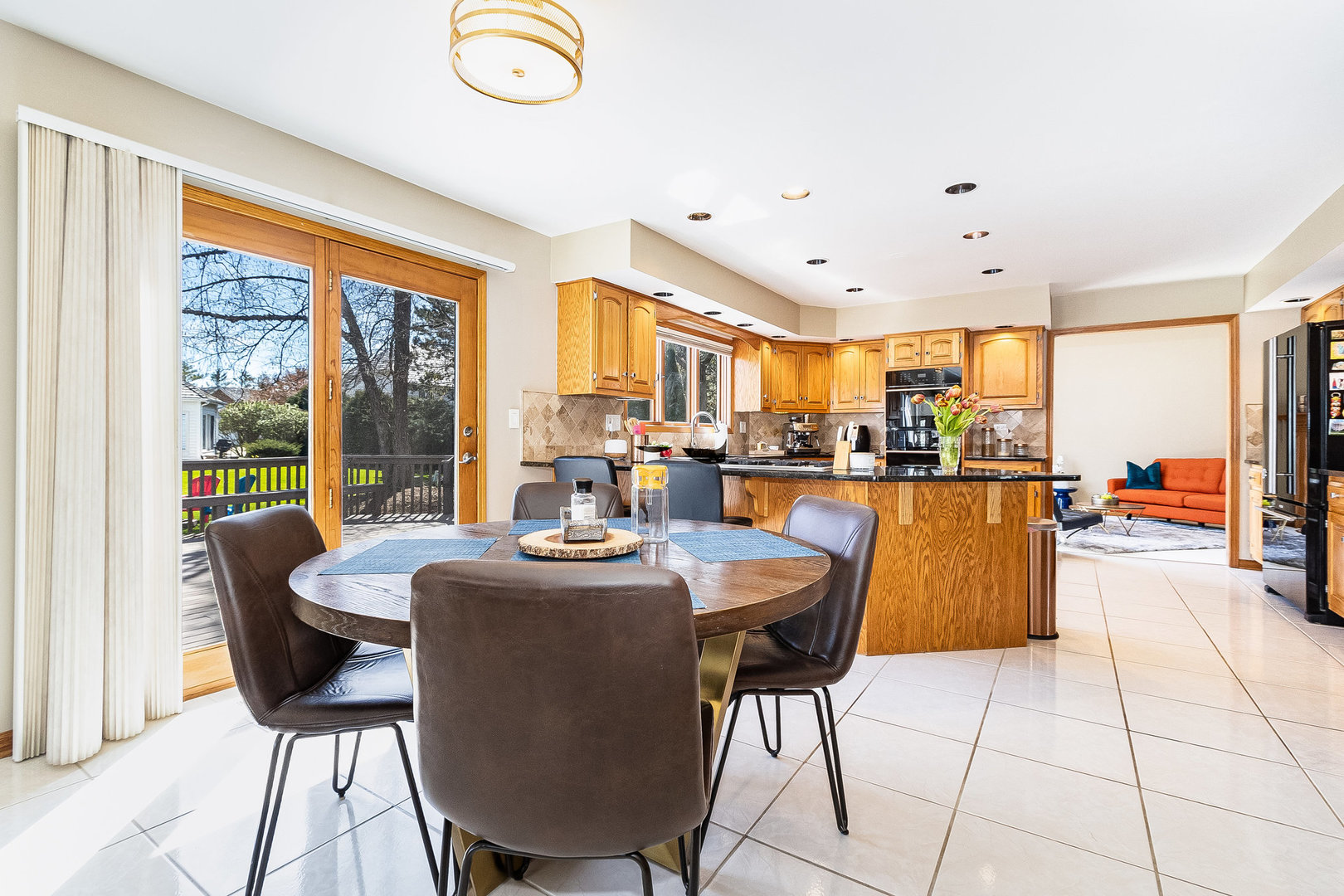2204 Arrowhead Drive Naperville, IL 60564 - Photo 11 of 40 a dining room with furniture and a floor to ceiling window