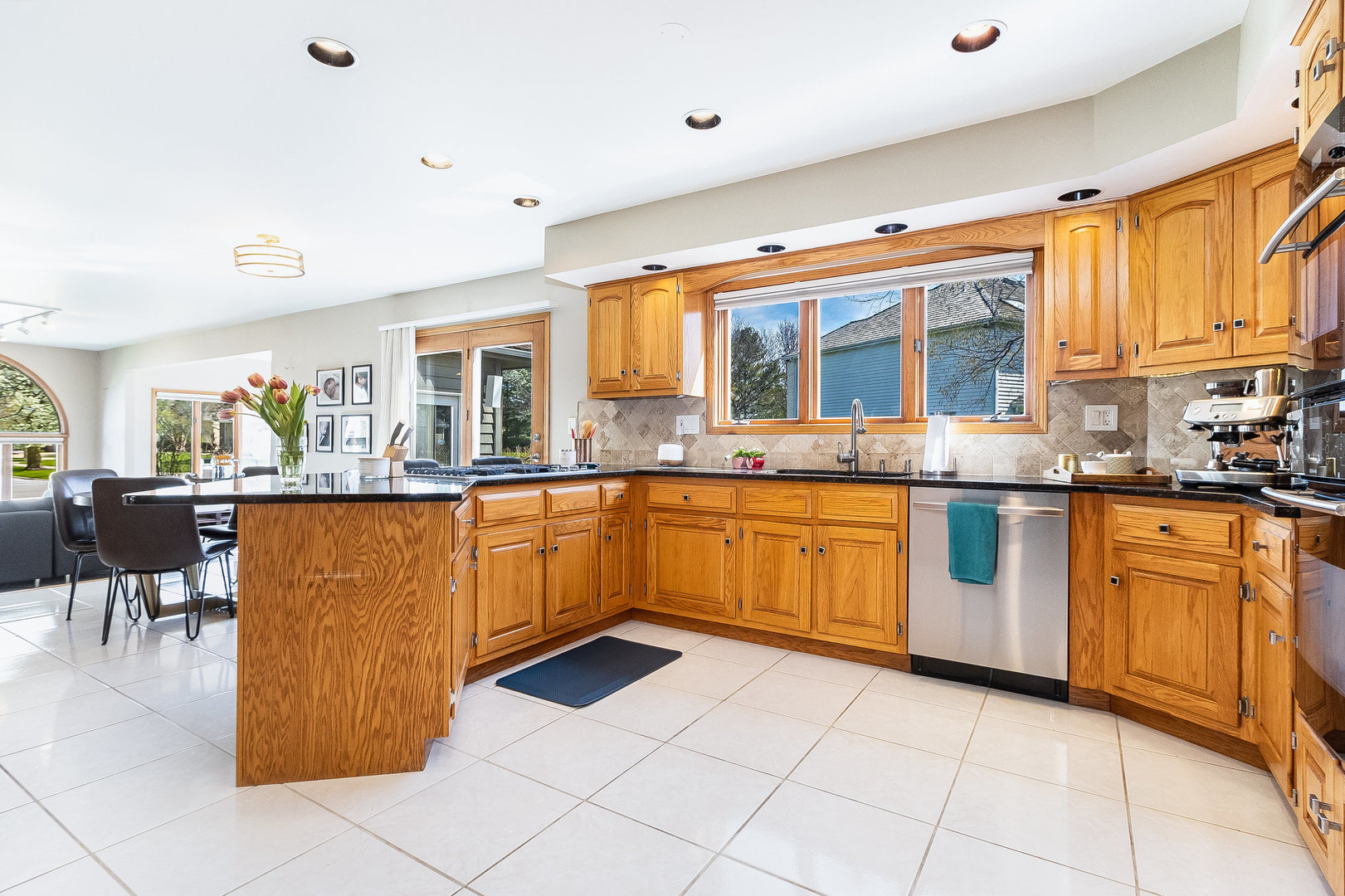 2204 Arrowhead Drive Naperville, IL 60564 - Photo 12 of 40 a kitchen with stainless steel appliances granite countertop a refrigerator and a sink