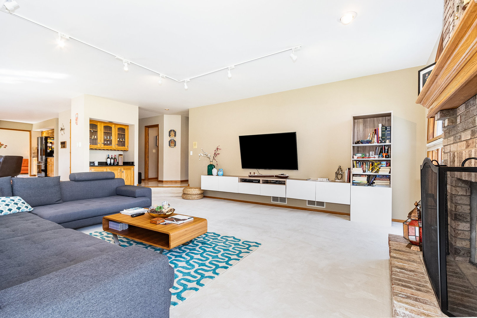 2204 Arrowhead Drive Naperville, IL 60564 - Photo 16 of 40 a living room with furniture and a flat screen tv