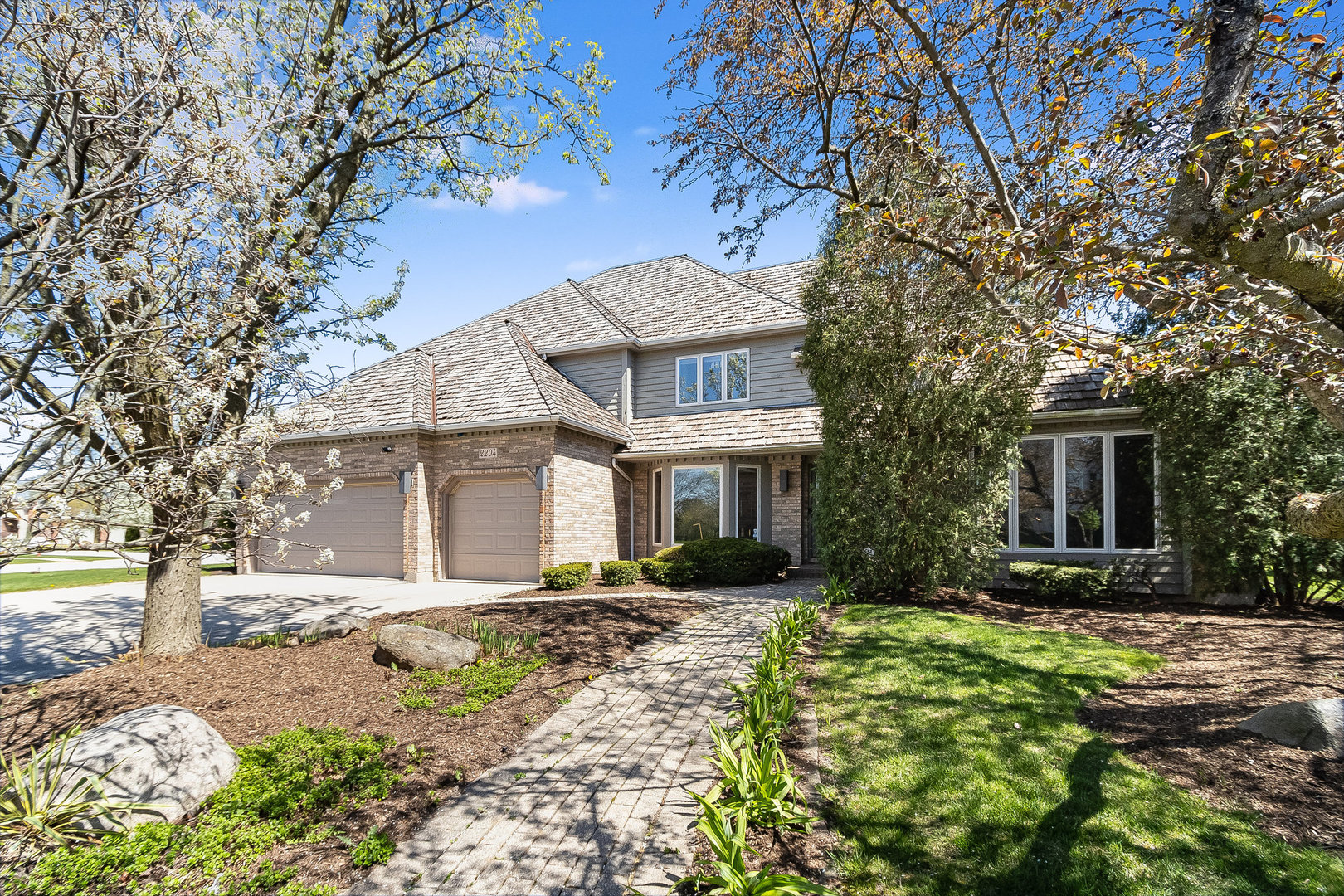 2204 Arrowhead Drive Naperville, IL 60564 - Photo 2 of 40 a front view of a house with a yard
