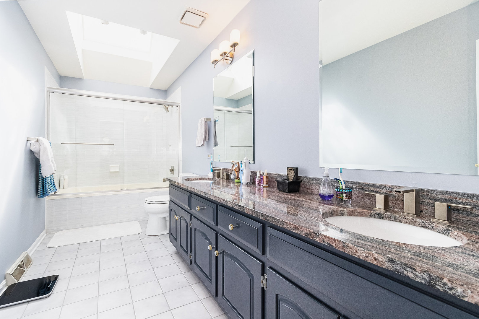 2204 Arrowhead Drive Naperville, IL 60564 - Photo 29 of 40 a bathroom with a granite countertop double vanity sink a mirror and bathtub