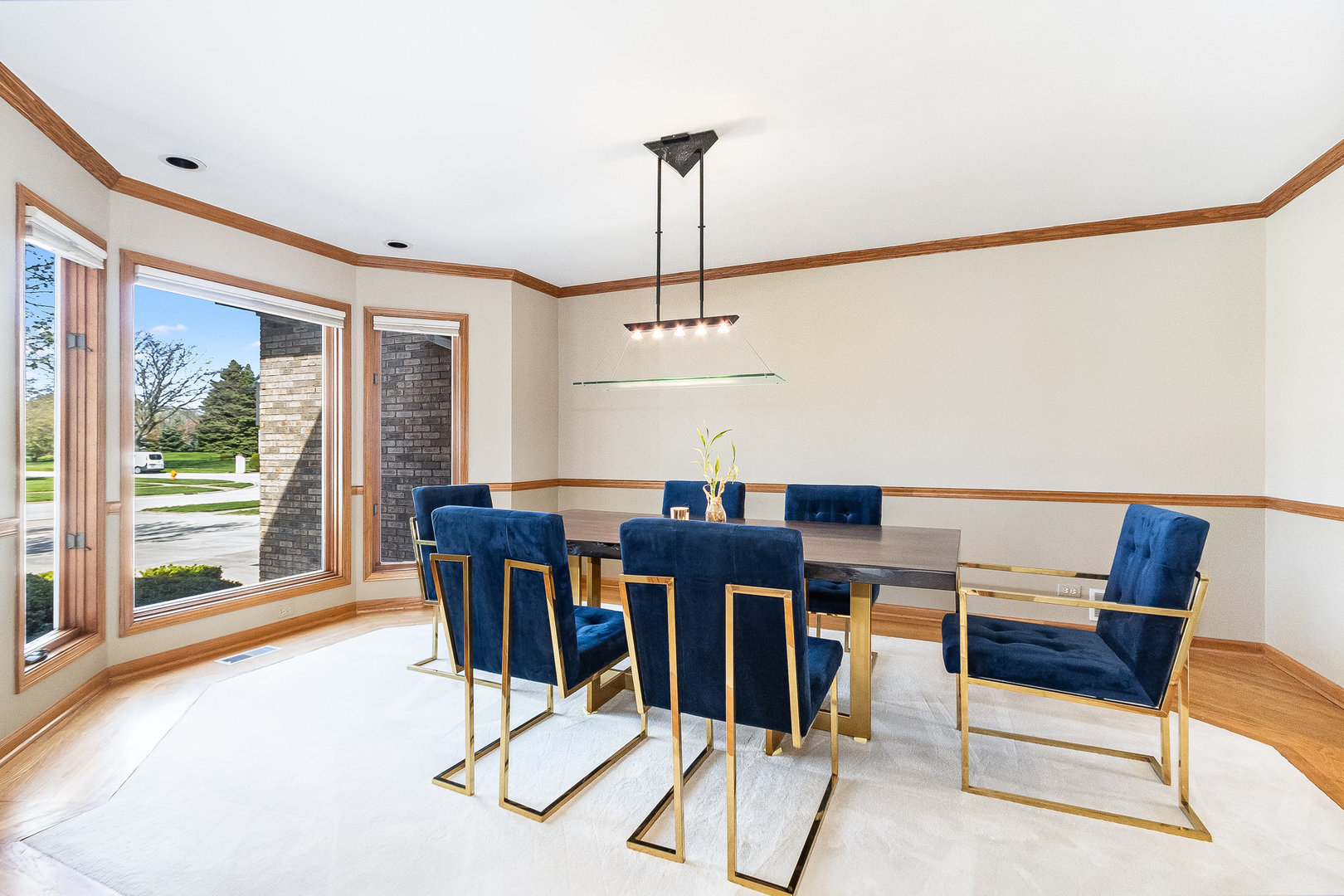 2204 Arrowhead Drive Naperville, IL 60564 - Photo 8 of 40 a dining room with furniture a chandelier and wooden floor