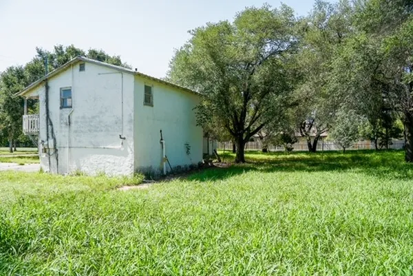 a backyard of a house with lots of green space