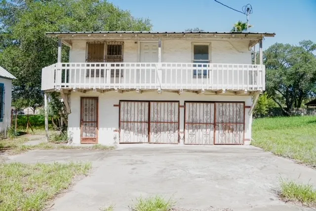 front view of a house with a small yard