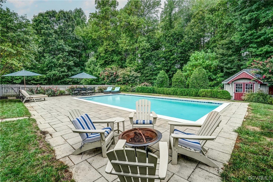 1790 Rabbit Warren Road Manakin-Sabot, VA 23103 - Photo 45 of 50 a view of a patio with lawn chairs next to a yard