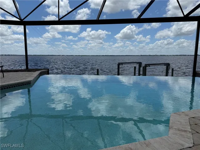 a view of a swimming pool with a patio