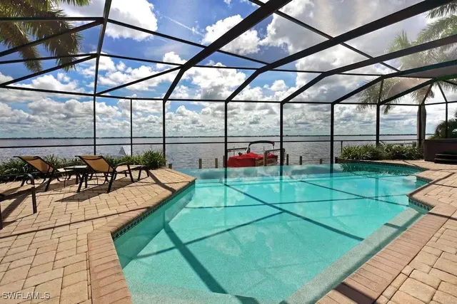 a view of a chairs and table in the patio
