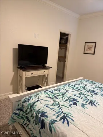 a large bathroom with a large tub and sink