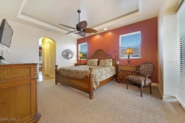 a bedroom with a bed and a mirror