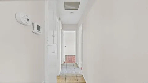 a view of a room with white walls