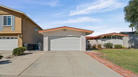an aerial view of residential house with outdoor space and parking