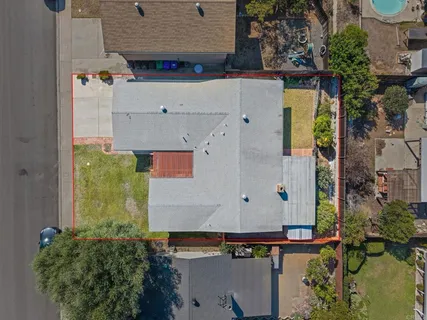 an aerial view of residential houses with outdoor space