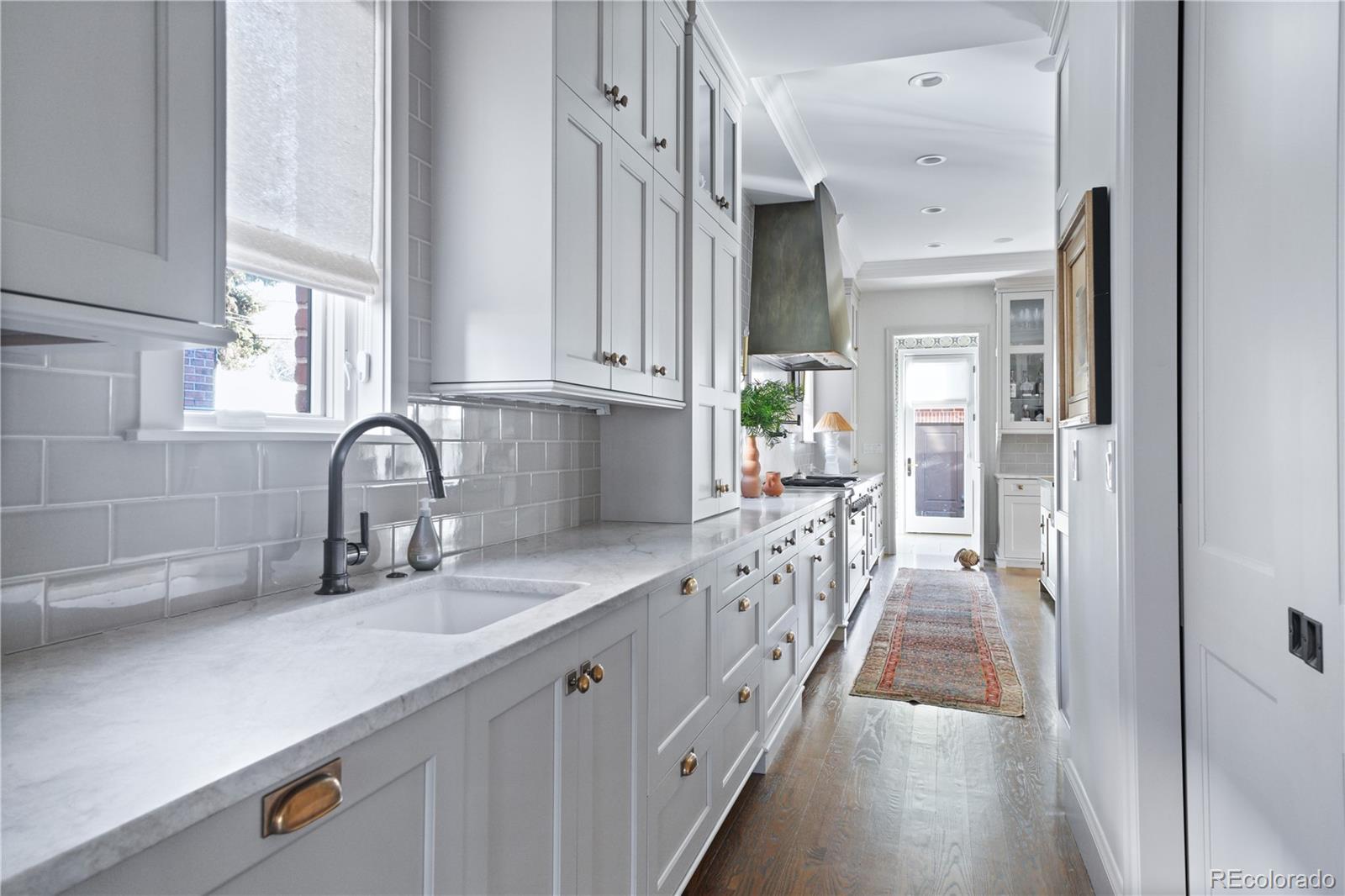 470 South York Street Denver, CO 80209 - Photo 13 of 36 a kitchen with granite countertop a sink and cabinets