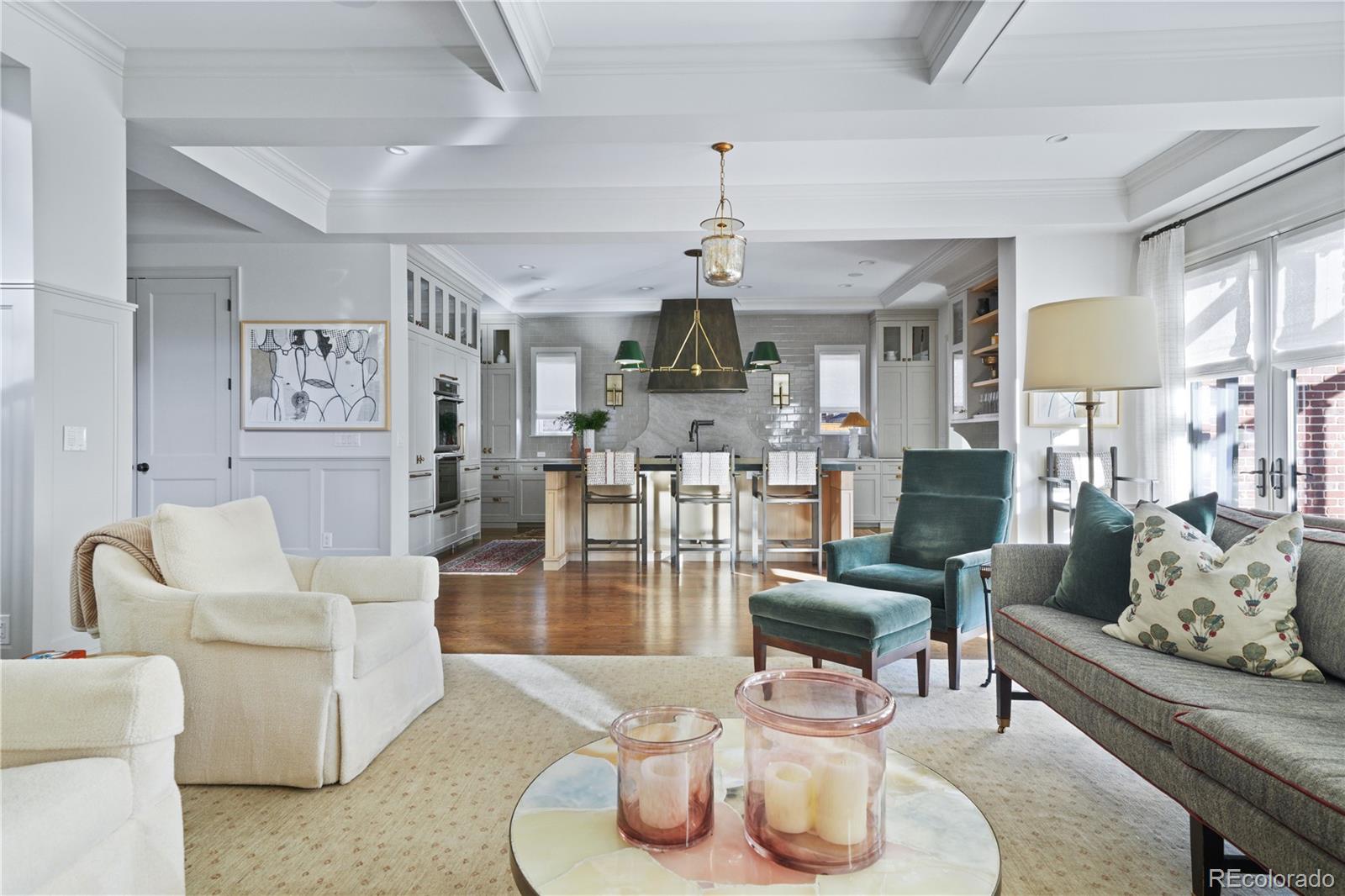 470 South York Street Denver, CO 80209 - Photo 16 of 36 a living room with furniture kitchen view and a chandelier