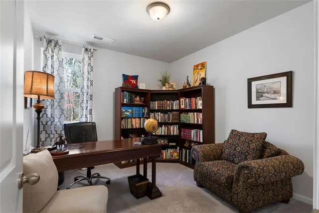 a work room with furniture and a workspace