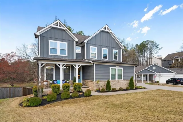 a front view of a house with a yard