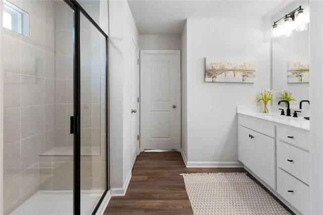 a hallway view with hardwood floor