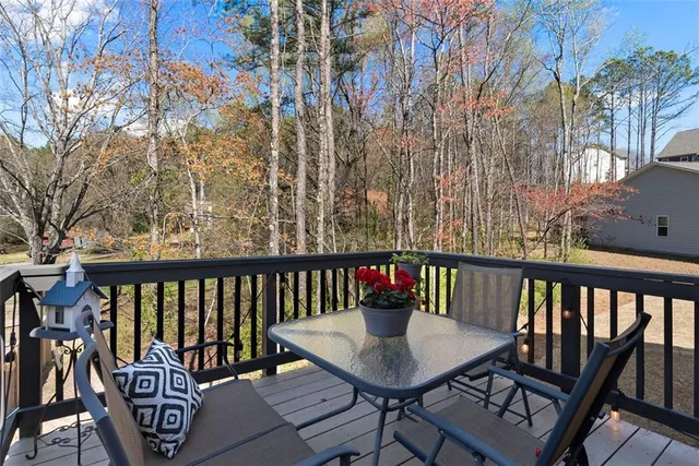 a view of a balcony with furniture