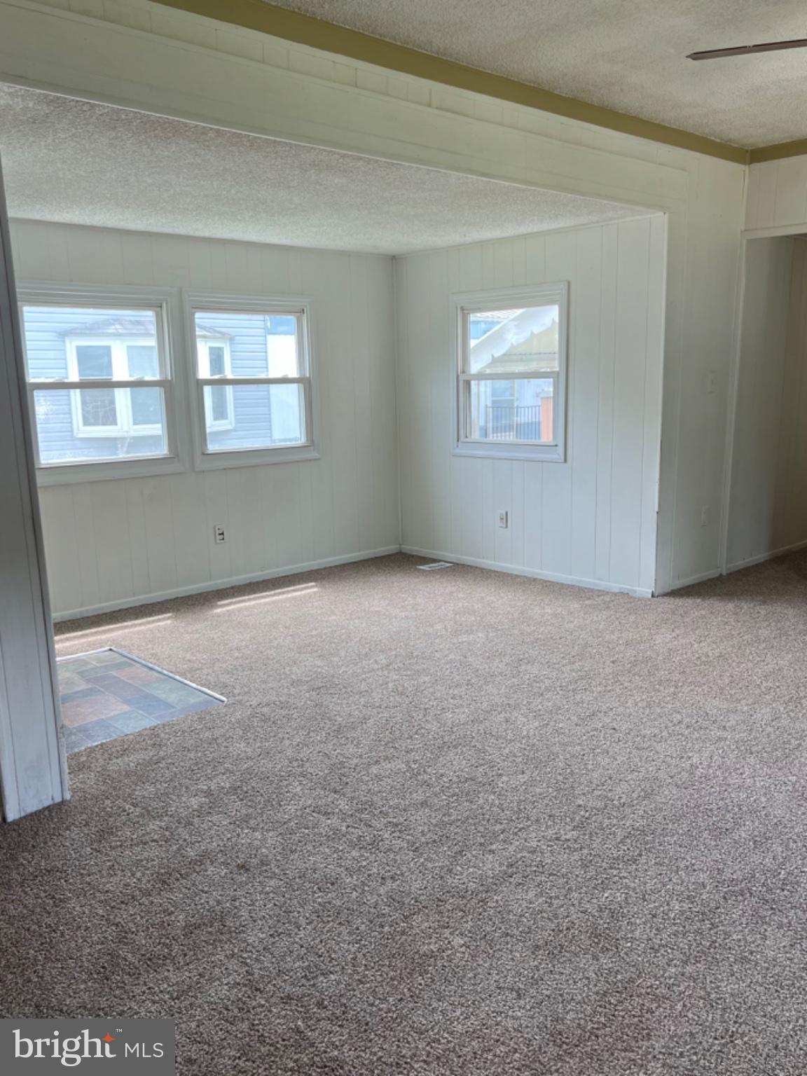 1302 Gibson Road, Unit 152 Bensalem, PA 19020 - Photo 7 of 18 a view of an empty room with a window