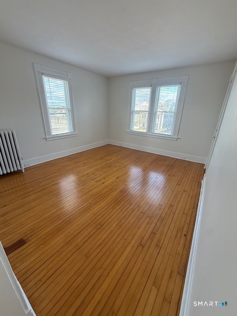 1 Cannon Square Stonington, CT 06378 - Photo 12 of 15 a view of empty room with wooden floor and fan