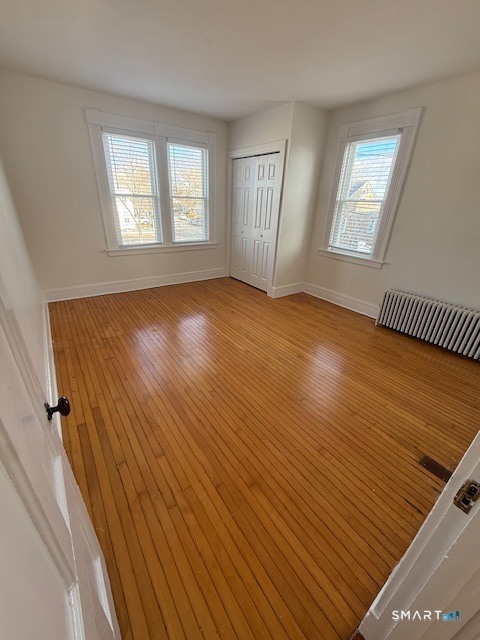 1 Cannon Square Stonington, CT 06378 - Photo 16 of 21 a view of an empty room with wooden floor and a window