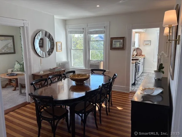 a dining room with furniture and window