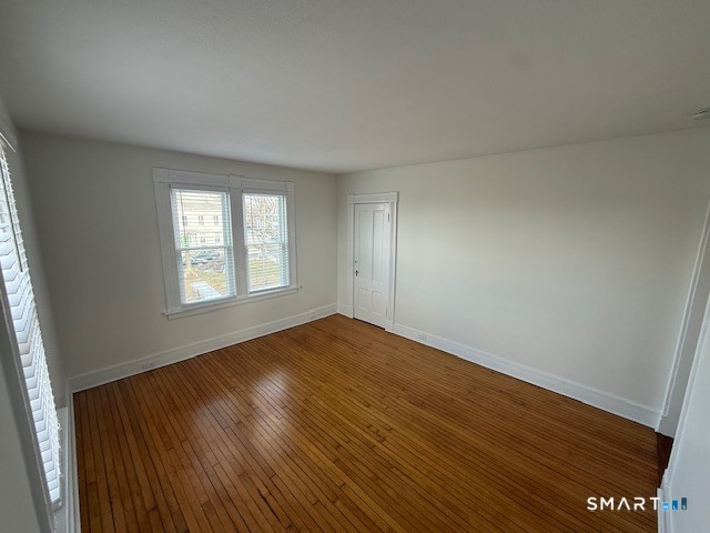 1 Cannon Square Stonington, CT 06378 - Photo 6 of 21 an empty room with wooden floor and windows