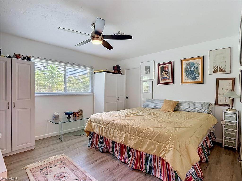 2280 Capri Court Naples, FL 34105 - Photo 48 of 49 a bed room with a bed and a desk