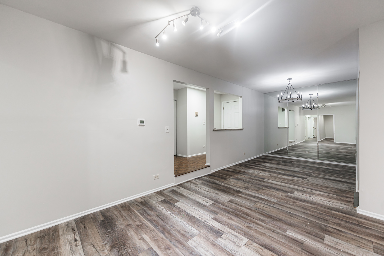 112 Morningside Lane West Buffalo Grove, IL 60089 - Photo 11 of 35 a view of a livingroom with wooden floor and a hallway