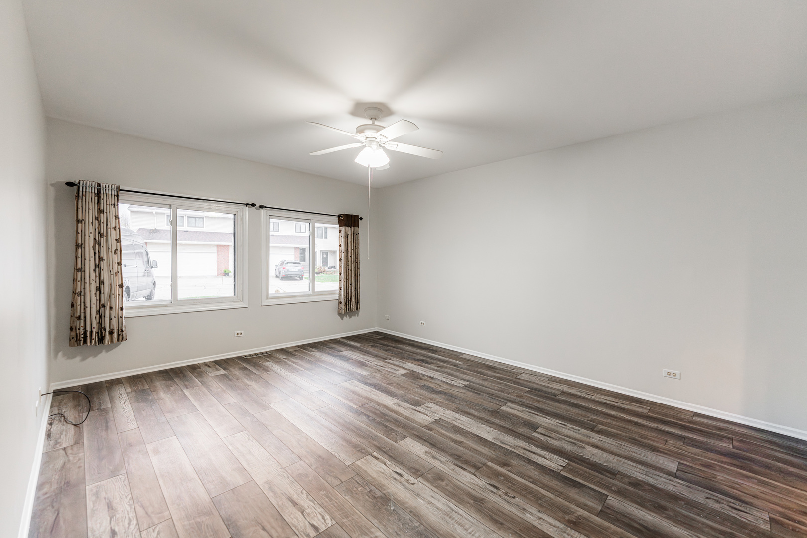 112 Morningside Lane West Buffalo Grove, IL 60089 - Photo 16 of 35 a view of an empty room with wooden floor and a window