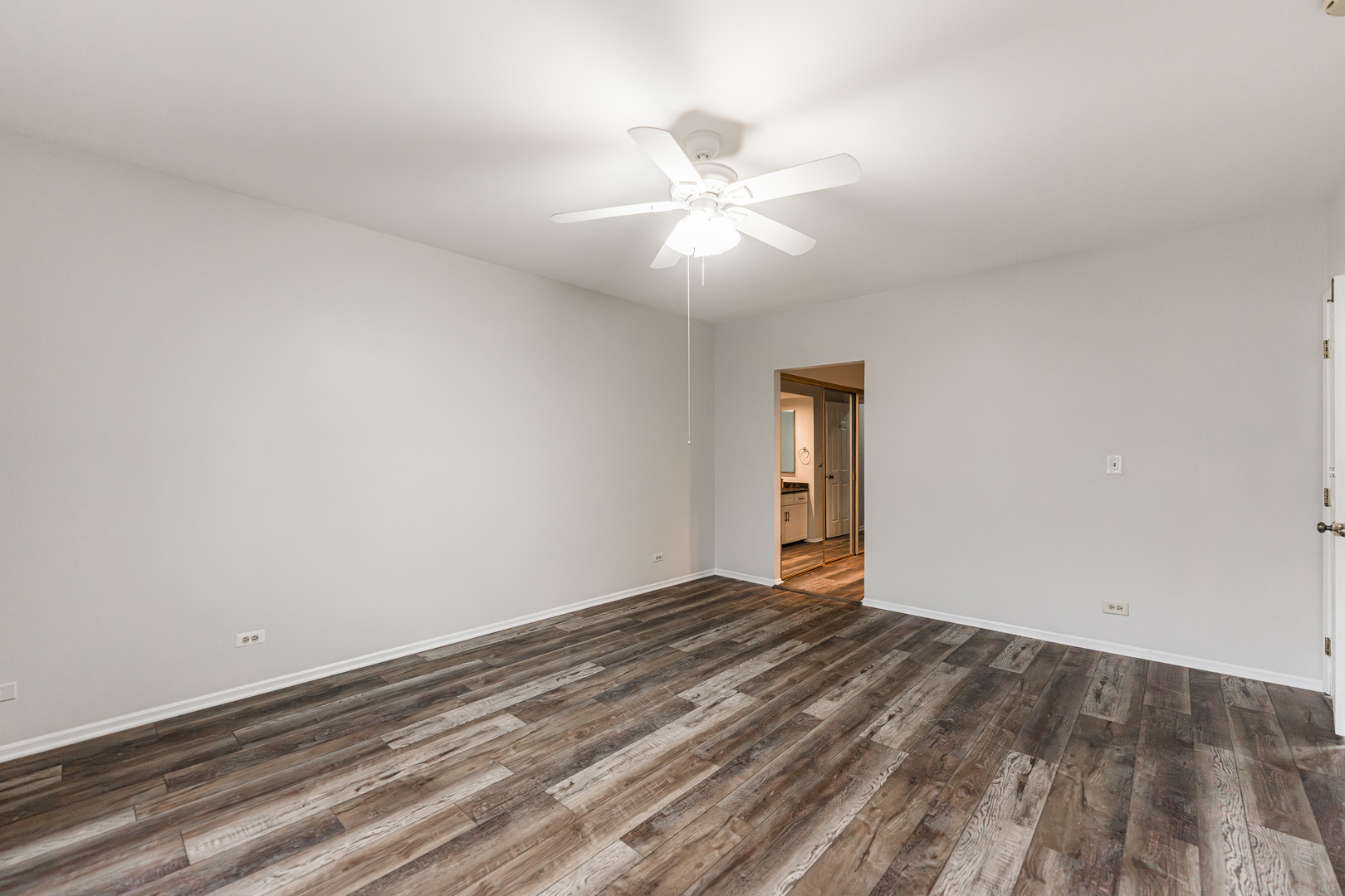 112 Morningside Lane West Buffalo Grove, IL 60089 - Photo 17 of 35 wooden floor in an empty room