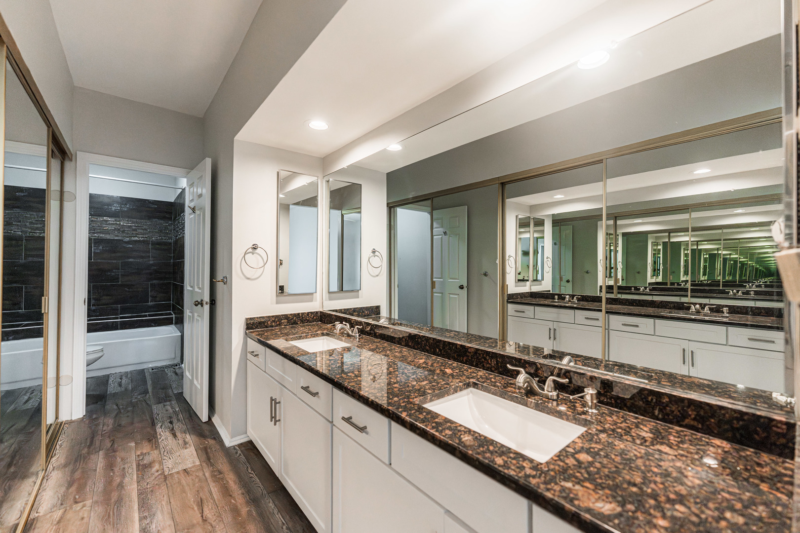 112 Morningside Lane West Buffalo Grove, IL 60089 - Photo 18 of 35 a bathroom with a granite countertop sink and a large mirror